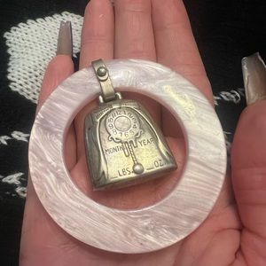 Sterling silver baby rattle marked by maker on the back